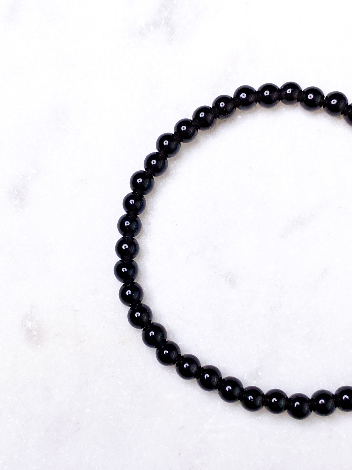 Svart obsidianarmband