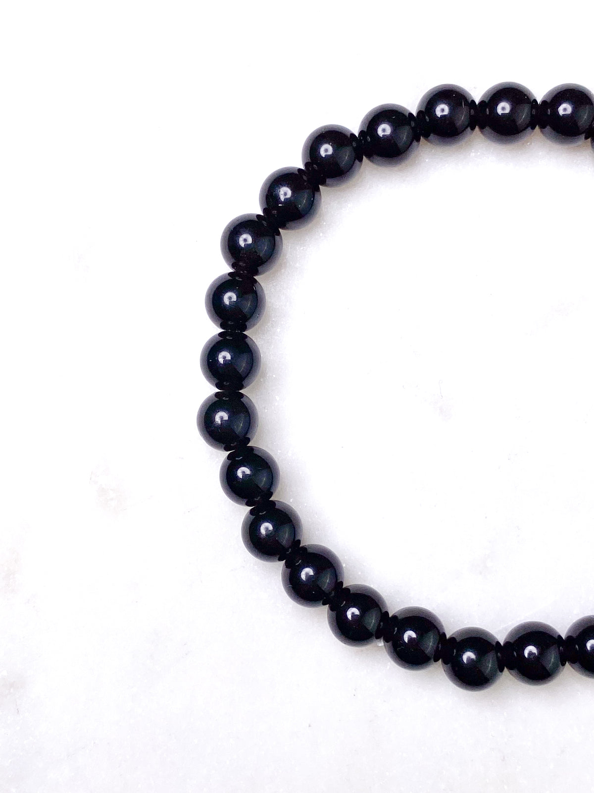 Svart obsidianarmband