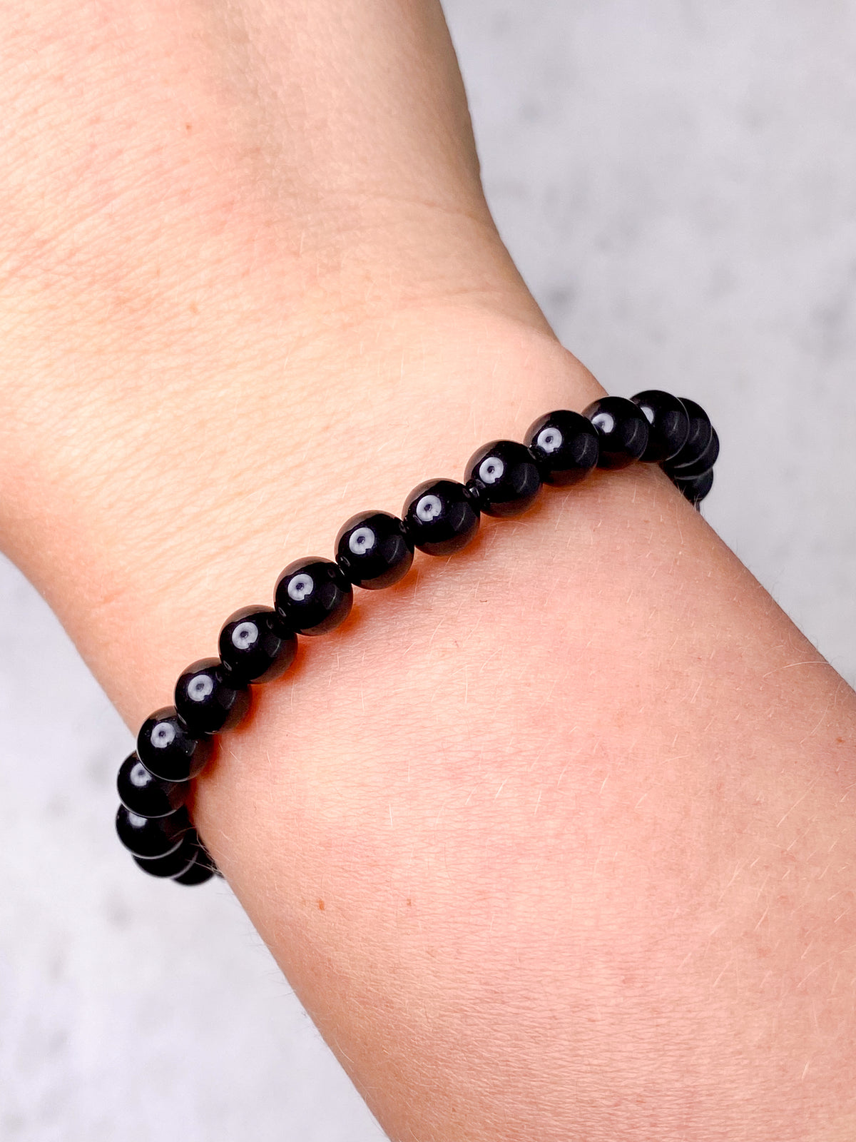 Svart obsidianarmband
